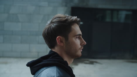 Closeup-of-young-man-walking-outside