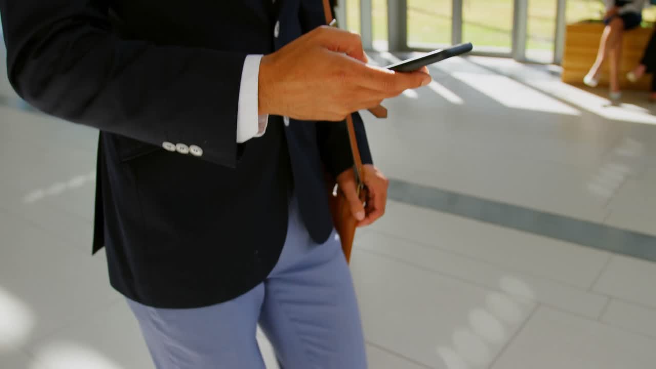 Businessman walking in the lobby at office 4k