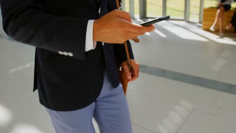 Businessman-walking-in-the-lobby-at-office-4k