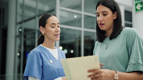 medical professionals discussing patient information in a hospital
