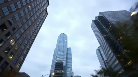 a captivating view of skyscrapers and urban architecture under cloudy skies, showcasing modern design and city life in a dynamic urban environment