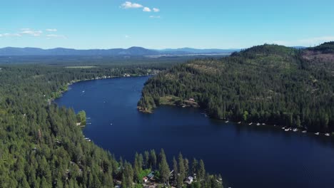 twin lakes surrounded by pine forest trees in kootenai county, idaho, united states