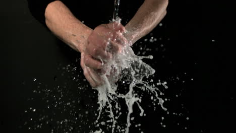 man washing his hands