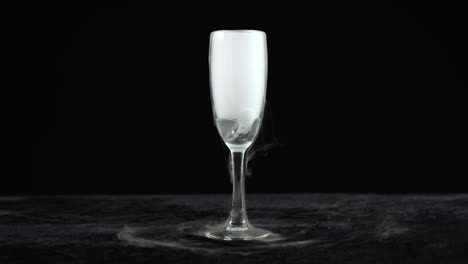 drink in glass of champagne with the effect of dry ice