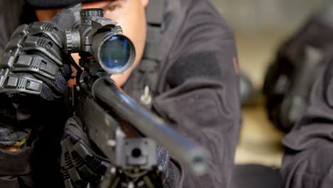 close-up of caucasian military soldiers firing rifle during training at military base 4k