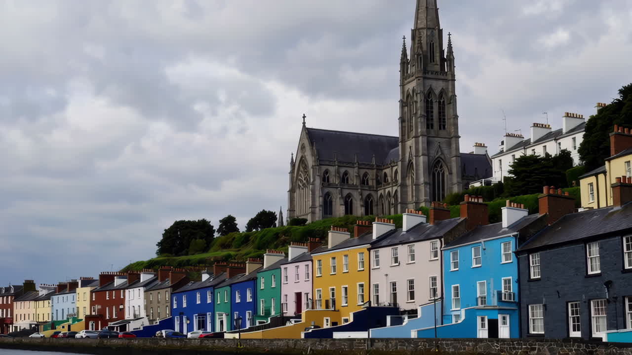Colorful Terraced Houses and St. Colman's Cathedral in Cobh, Ireland