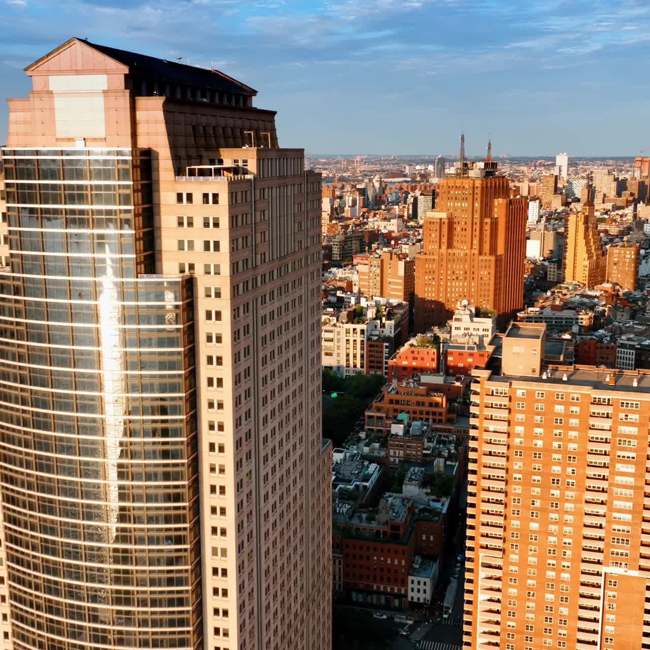 Wonderful sunlit cityscape of New York in the morning. Diverse architecture in the metropolis panorama. Top view