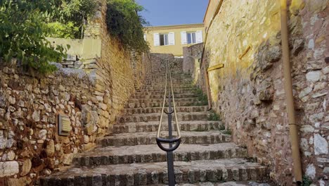 beautiful old stone stairs in a small historic village in france in the sun