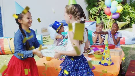 Animation-of-confetti-falling-over-children-giving-present-and-having-fun-at-birthday-party