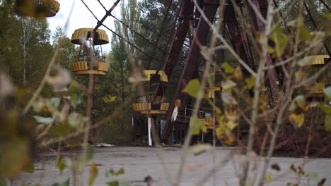 ferris wheel at the abandoned amusement park affected by chernobyl disaster in pripyat, ukraine during autumn