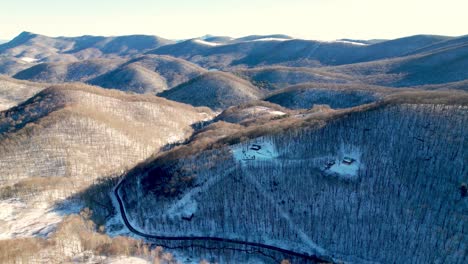 Aerial-Winter-Tilt-Down-Mountain-Range-In-Watauga-County-NC,-North-Carolina