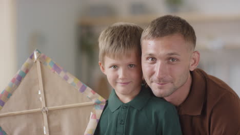 father and son with kite