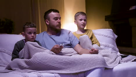 Father-and-sons-watching-film