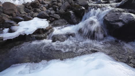 Water-Running-Down-On-River-With-Ice-On-Rocks-In-Grundarfoss-Waterfall,-Iceland