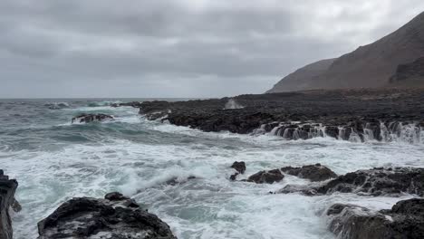 nice volcanic and black rocky beach in gran canaria , in spain