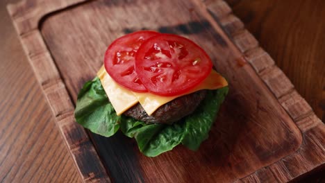 chef preparing a delicious cheeseburger