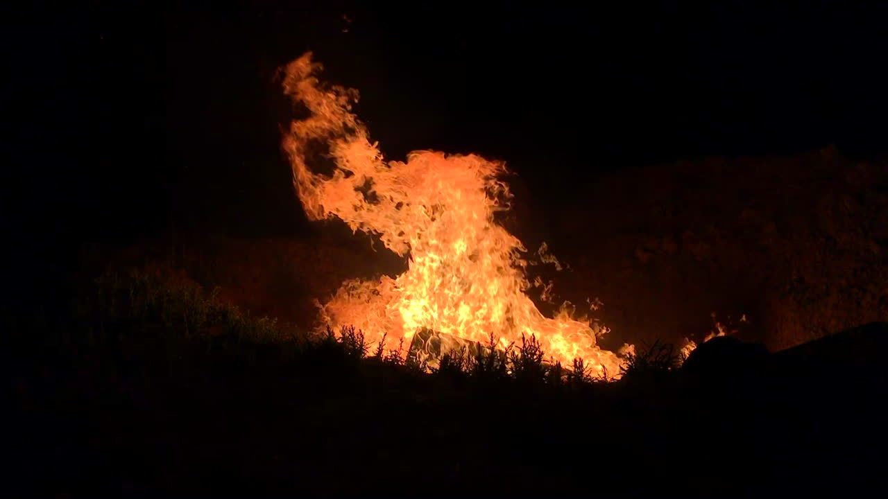 Huge fire burning in a fire pit.
