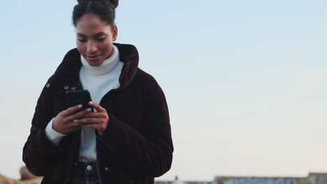 african american girl using mobile phone.