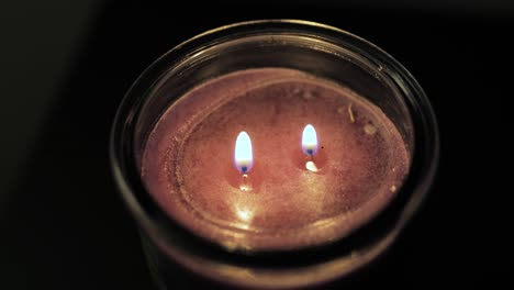 candle with two fires two wicks seen from top down