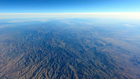 airplane window view over magnificent mountainous america