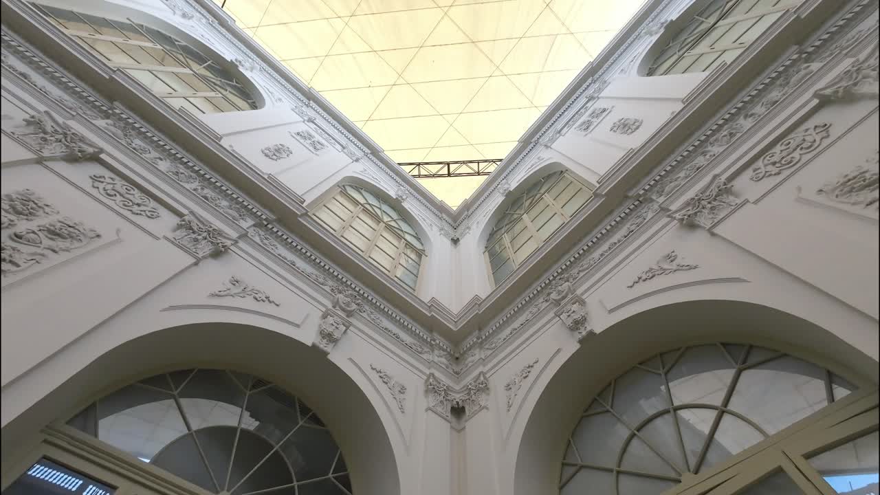 Upward Pan of a Grand Classical Hall with Ornate Details