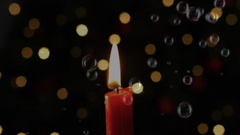 animation of lit candle with flickering spots of light