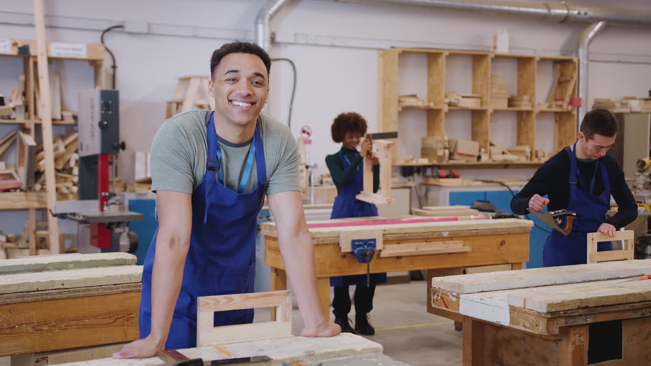 Portrait Of Male Student Studying For Carpentry Apprenticeship At College