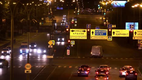 nighttime city intersection with traffic