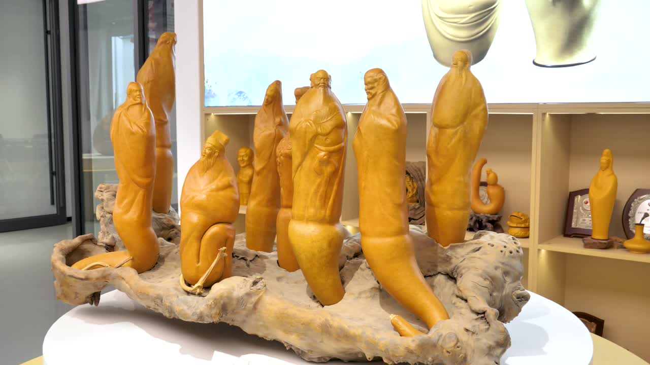 A fan-made gourd ornament depicting the Eight Immortals Crossing the Sea, showcasing intricate details and vibrant colors in slow motion. Liaocheng, China