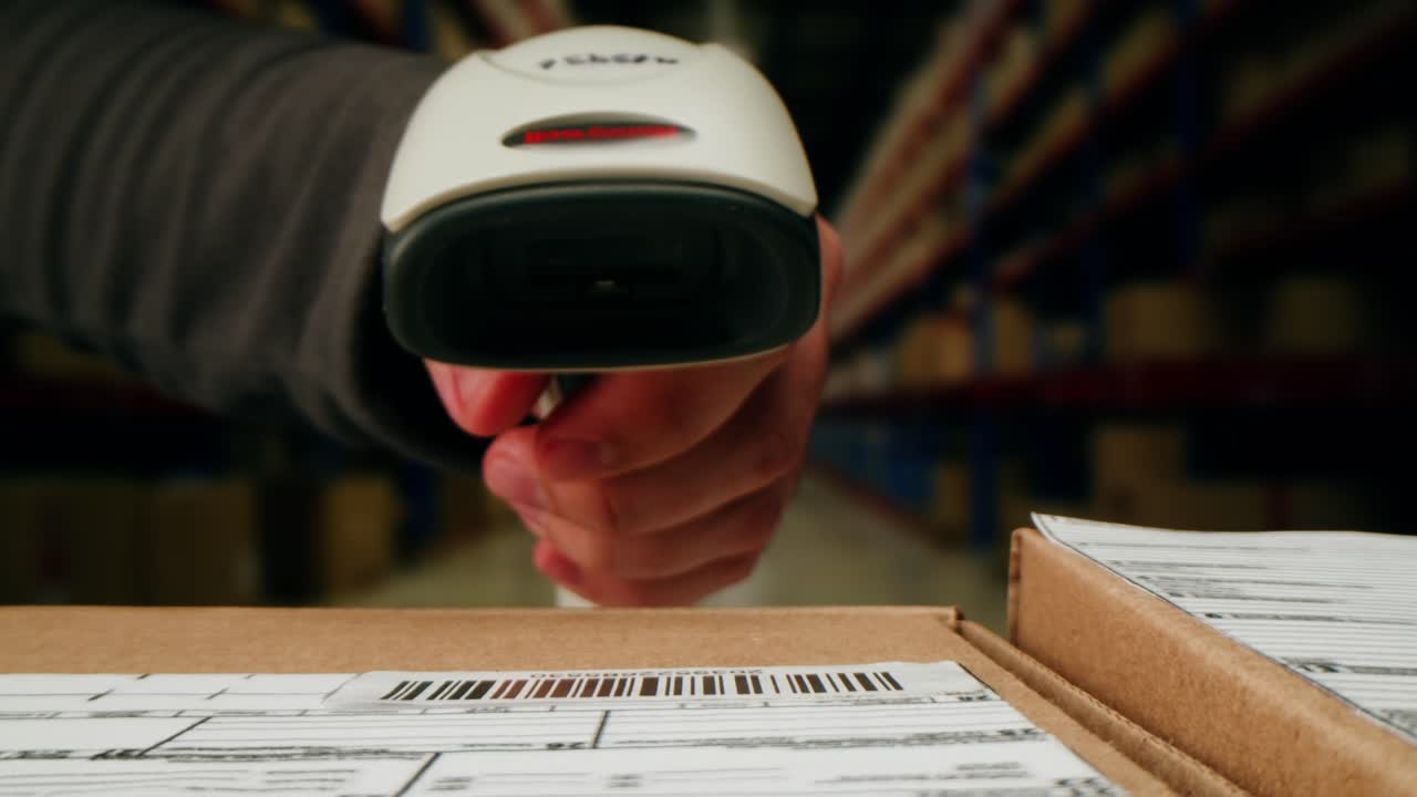 Scanner scan delivery box in storage, E-commerce shop, man packing goods and clothes second hand delivery market, courier Packaging and Shipping Workspace with Supplies and Technology, online sales.