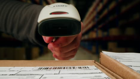 scanner scan delivery box in storage, e-commerce shop, man packing goods and clothes second hand delivery market, courier packaging and shipping workspace with supplies and technology, online sales.