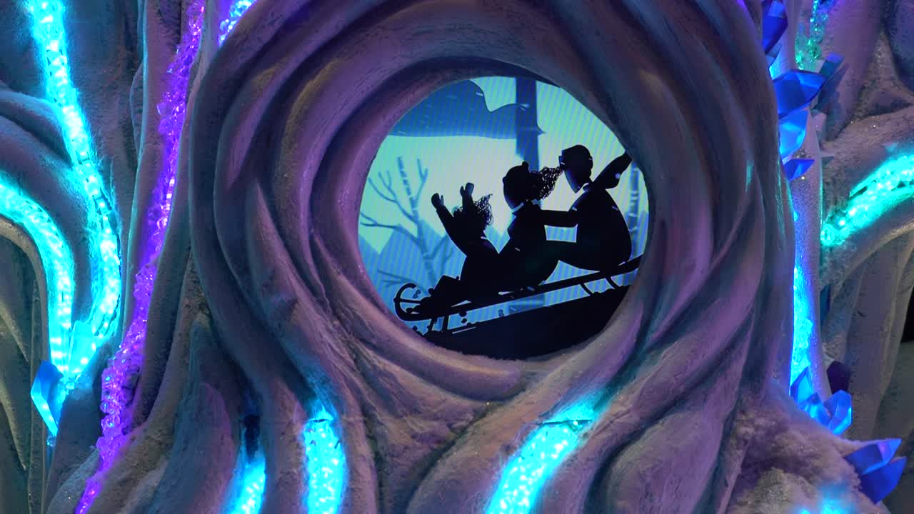 Christmas cartoons about sledding and sculpting a snowman by children. Blue Christmas Animation with silhouette shape