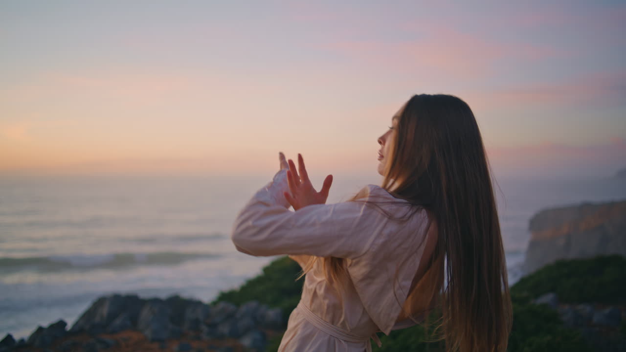 Talented woman dancing improvisation at sunset ocean hill closeup. Lady dance