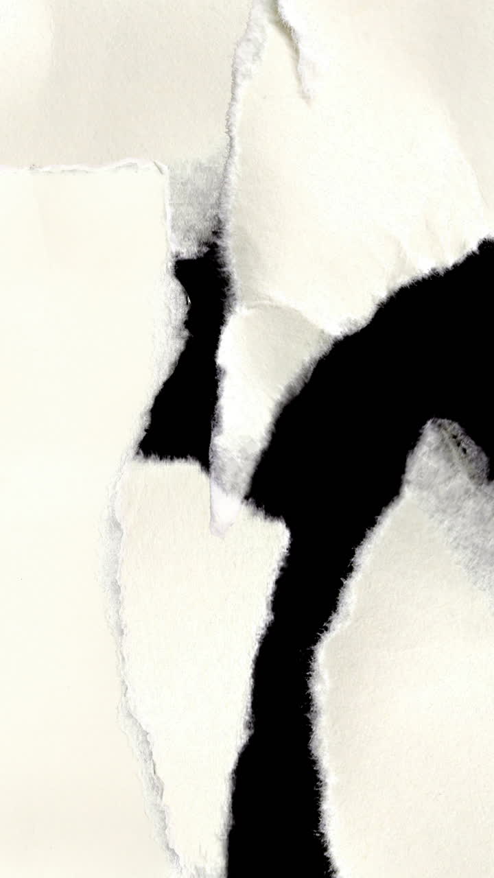 Abstract White Torn Paper Revealing Black Background