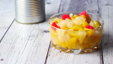 canned fruit salad in glass bowl