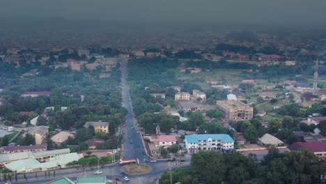 highway and roundabout intersection in jos town, nigeria on a hazy day - aerial