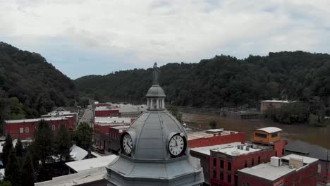 aerial view of a courthouse in a small town by the river
