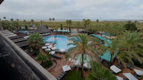 view from the balcony of the beach, the sea, and the resort hotel in huelva, andalusia, spain