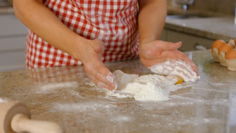 Woman-baking-with-egg-and-flour