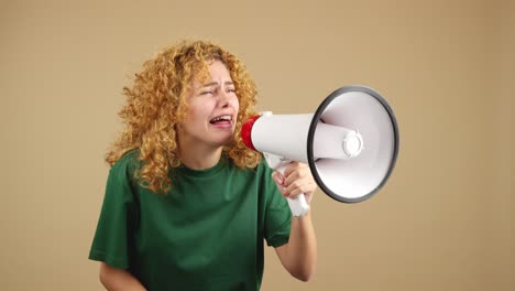 woman with megaphone expressing a range of strong emotions, from shouting to crying