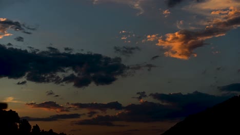 colorful sunset 4k time-lapse with rapid clouds movement and fading out into darkness