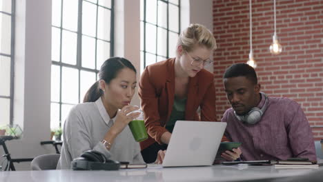 professional business people brainstorming caucasian team leader woman discussing ideas collaborating colleagues working planning project using computer technology in multi ethnic office