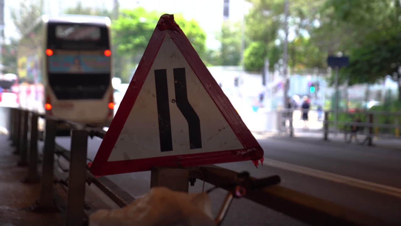 Hongkong- May 20, 2022: close up shot of traffic signs. Hong Kong never sleeps with busy streets with cars and trucks passing by