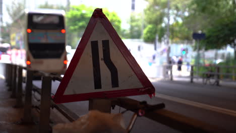 hongkong- may 20, 2022: close up shot of traffic signs. hong kong never sleeps with busy streets with cars and trucks passing by