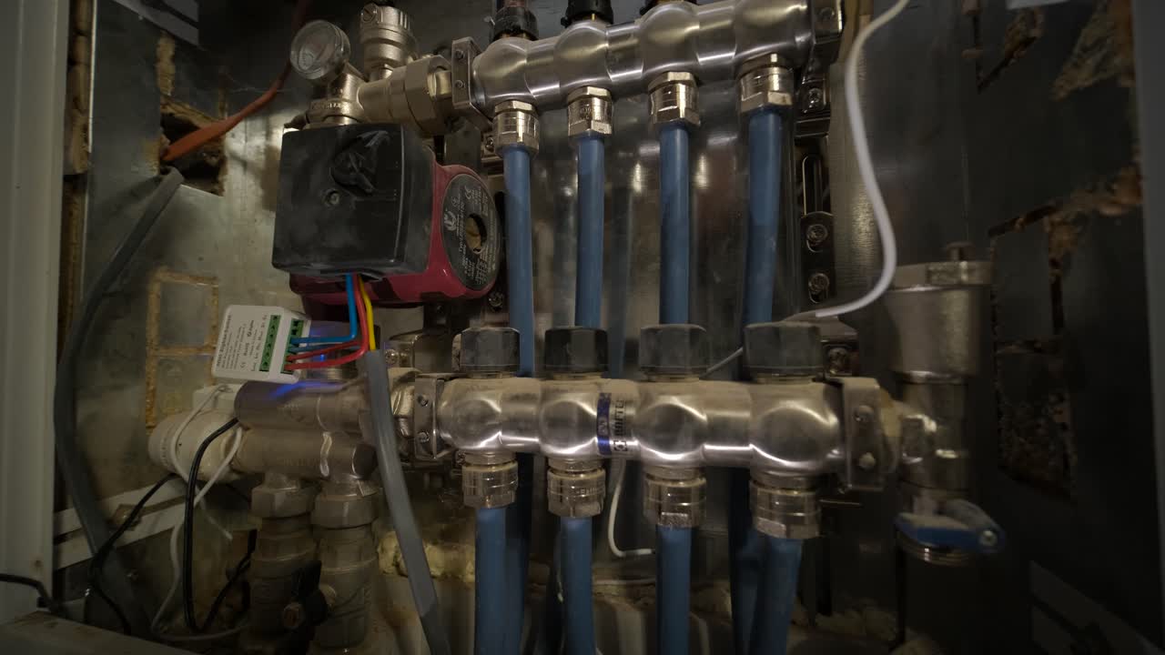 Close-up of a Plumbing Manifold with Pipes and Valves