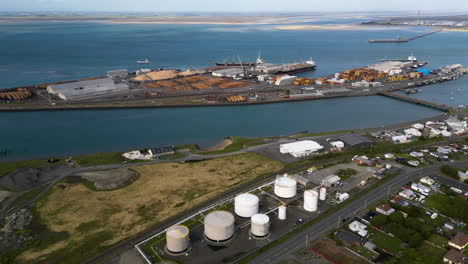 cargo port in bluff, new zealand with loading dock for timber export, aerial view