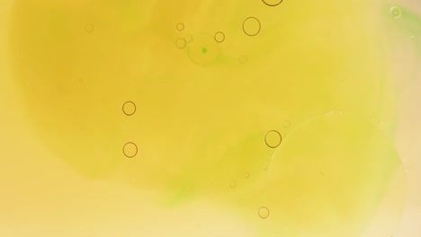 Animation-of-bubbles-moving-on-yellow-liquid-with-copy-space