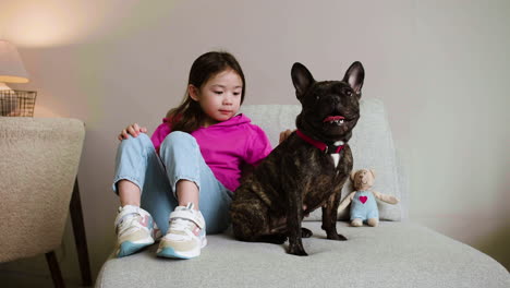 girl playing with dog