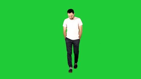 man in casual walking on a green screen, chroma key