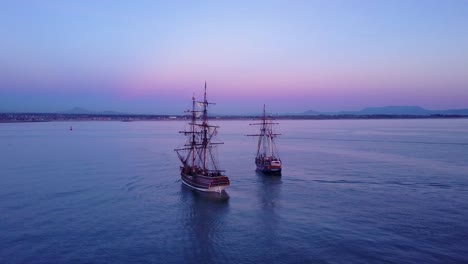 Spectacular-aerial-of-two-tall-sailing-ships-on-the-open-ocean